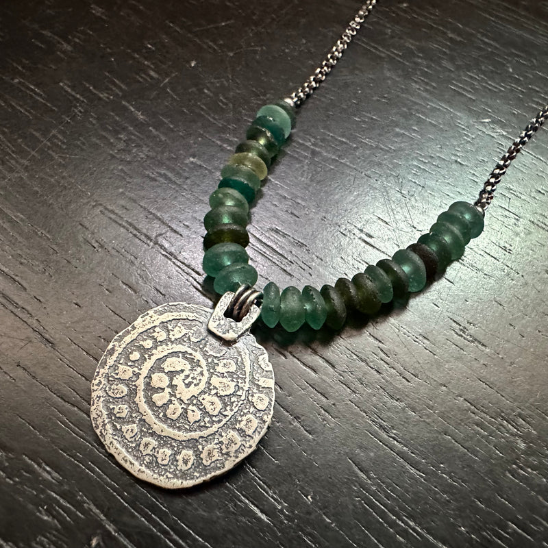 ORIJEN'S: Silver Reversible Textured Disc Necklace with Roman Glass