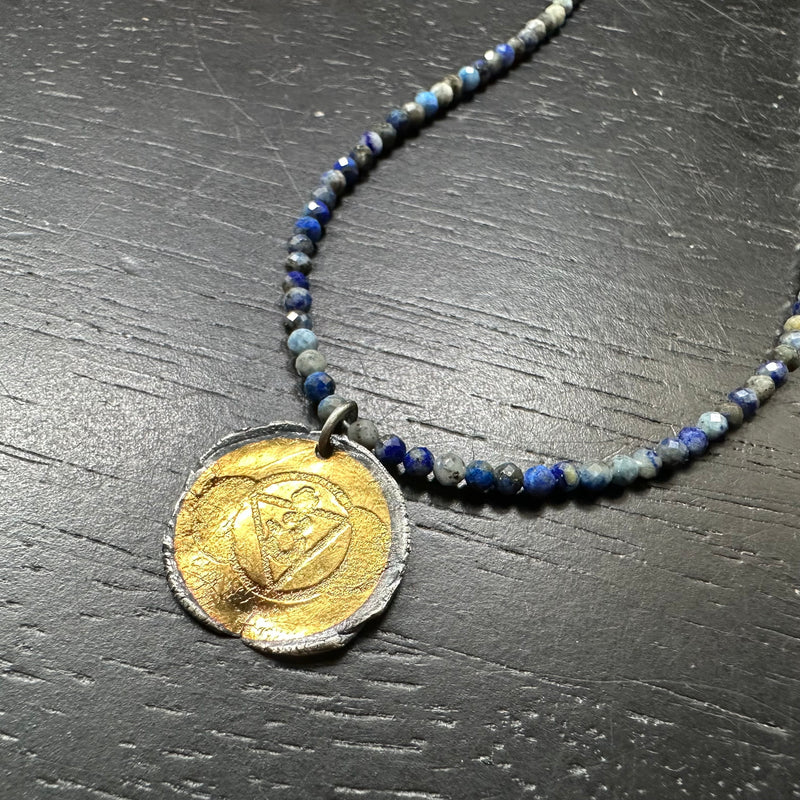 Chakra Kahn: GOLD + SILVER THIRD EYE Pendant on full strand of Lapis