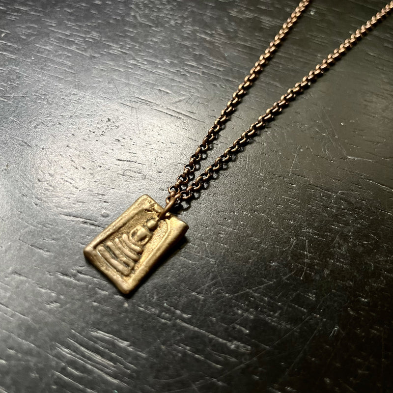 Brass Tiny Buddha pendant on Brass Chain