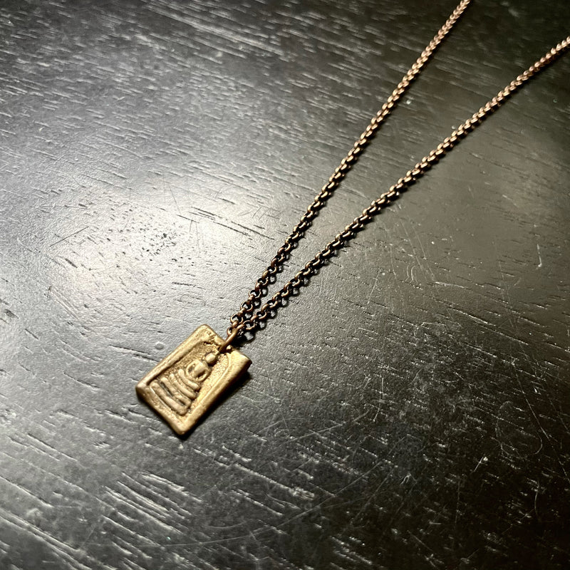 Brass Tiny Buddha pendant on Brass Chain